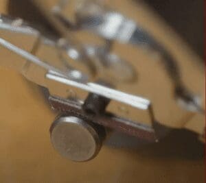 Close-up of sanding deburring pad on tool